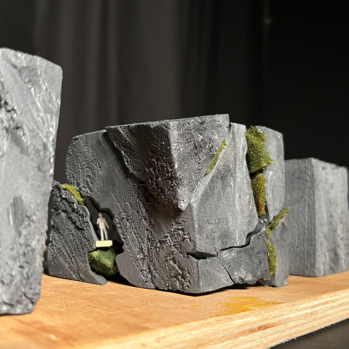 Concept model photo showing a person within one of the cracks, showing their experience with the greenery.