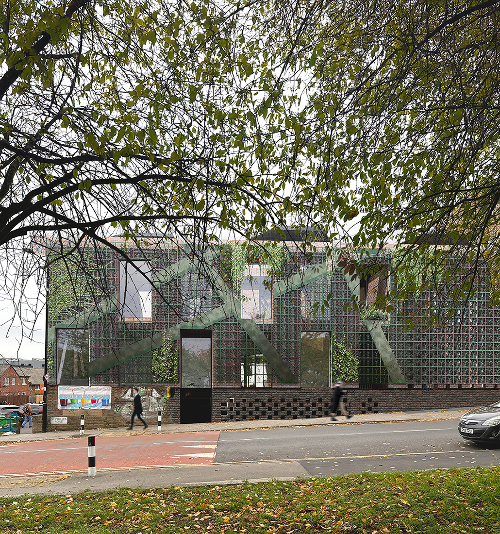 External visual showing the green metal facade on the west elevation, with climbers growing up it.